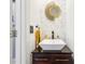 Modern bathroom with herringbone tile, floating vanity, and gold mirror at 632 Graymont Dr, Grayson, GA 30017