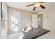 Well-lit bedroom featuring a cozy bed and a view of the backyard at 632 Graymont Dr, Grayson, GA 30017