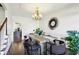 Bright dining room with hardwood floors, chandelier, and large window at 632 Graymont Dr, Grayson, GA 30017