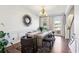 Formal dining room with hardwood floors, chandelier, and large window at 632 Graymont Dr, Grayson, GA 30017