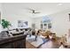 Sunlit living room featuring hardwood floors and comfortable furniture at 632 Graymont Dr, Grayson, GA 30017