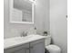 Bathroom with grey vanity and white subway tile at 1042 Plantation Nw Way, Kennesaw, GA 30144