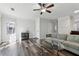 Living room with hardwood floors and large windows at 1042 Plantation Nw Way, Kennesaw, GA 30144