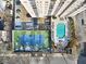 Aerial view of an apartment complex with a pool and tennis court at 325 E Paces Ferry Rd # 2003, Atlanta, GA 30305