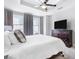 Well-lit bedroom with a king-size bed, soft carpeting, and a large dresser at 325 E Paces Ferry Rd # 2003, Atlanta, GA 30305