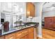 Kitchen boasts granite countertops and wood cabinets at 325 E Paces Ferry Rd # 2003, Atlanta, GA 30305