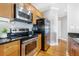 Stainless steel appliances and wood cabinets in kitchen at 325 E Paces Ferry Rd # 2003, Atlanta, GA 30305