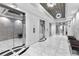 Elegant lobby with marble floors, mirrored walls, and sophisticated lighting at 325 E Paces Ferry Rd # 2003, Atlanta, GA 30305