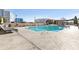 Inviting outdoor swimming pool surrounded by lounge chairs on a sunny day, perfect for relaxation at 325 E Paces Ferry Rd # 2003, Atlanta, GA 30305