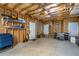 Unfinished basement with exterior access and storage shelving at 109 Slate Dr, Buford, GA 30518