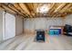 Unfinished basement with foosball table and sliding barn door at 109 Slate Dr, Buford, GA 30518