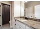 Bathroom with granite countertop, white cabinets, and shower at 109 Slate Dr, Buford, GA 30518