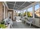 Relaxing screened porch with comfortable seating and a ceiling fan at 109 Slate Dr, Buford, GA 30518