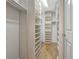 Large walk-in closet with shelving and hanging rods at 1800 Clairmont Lk # A-519, Decatur, GA 30033