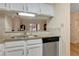 Kitchen features granite countertops and white cabinets at 1800 Clairmont Lk # A-519, Decatur, GA 30033