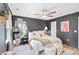 Main bedroom with dark gray walls, king bed, and geometric wall paneling at 665 Windsor Sw St, Atlanta, GA 30310