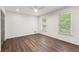 Bright bedroom featuring hardwood floors and ample natural light at 263 Weldon Rd, Palmetto, GA 30268