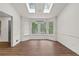 Bright dining room, hardwood floors, and a modern chandelier at 263 Weldon Rd, Palmetto, GA 30268