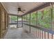 Screened porch overlooks backyard with a ceiling fan at 263 Weldon Rd, Palmetto, GA 30268