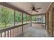 Relaxing screened porch with ceiling fan and wooded views at 263 Weldon Rd, Palmetto, GA 30268