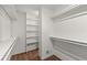 Large walk-in closet with built-in shelves and hanging rods at 263 Weldon Rd, Palmetto, GA 30268
