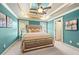 Spacious bedroom with a large bed, ceiling fan, and teal walls at 3200 Saute Way, Avondale Estates, GA 30002