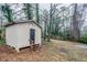 Small storage shed in backyard with wooden steps and door at 3743 Turner Heights Dr, Decatur, GA 30032