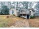 Tan house with blue door, deck, and paved driveway at 3743 Turner Heights Dr, Decatur, GA 30032