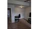 Versatile bonus room with neutral carpet, a ceiling fan, and space for a desk and entertainment area at 2502 Polaris Sw Way, Atlanta, GA 30331