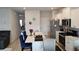 Spacious kitchen with white cabinetry, stainless steel appliances, and a breakfast bar at 2502 Polaris Sw Way, Atlanta, GA 30331