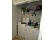 Practical laundry room showcasing a full-size washer and dryer and wire shelving for storage at 2502 Polaris Sw Way, Atlanta, GA 30331