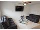Comfortable living room with dual reclining sofas, a mirrored coffee table and ceiling fan at 2502 Polaris Sw Way, Atlanta, GA 30331