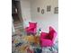 Cozy sitting area with plush pink chairs and a decorative 'HOME' sign at 2502 Polaris Sw Way, Atlanta, GA 30331