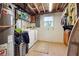 Basement laundry area with washer, dryer, and ample space for storage at 190 Hembree Forest Cir, Roswell, GA 30076