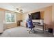 Spacious bedroom offering a large window, ceiling fan, and closet at 190 Hembree Forest Cir, Roswell, GA 30076
