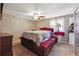 Well-lit bedroom with ceiling fan, space, a bed, and closet at 190 Hembree Forest Cir, Roswell, GA 30076