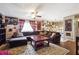 Spacious living room with a large sectional, area rug, and ceiling fan at 190 Hembree Forest Cir, Roswell, GA 30076