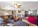 Living room flows into dining area featuring dark hardwood floors, eclectic décor, and ample seating at 190 Hembree Forest Cir, Roswell, GA 30076