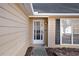 House exterior featuring a front door and window with shutters at 5659 Rex Mill Crk, Rex, GA 30273