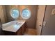 Bathroom with a double vanity and circular windows at 2025 Austin Park Cir, Decatur, GA 30032