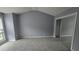 Second bedroom with mirrored closet and large window at 2025 Austin Park Cir, Decatur, GA 30032