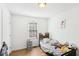 Cozy bedroom with natural light, a laminate floor, and ample space for relaxation at 65 Bridge Dr, Douglasville, GA 30134