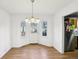 Bright dining area with view of kitchen, plenty of natural light, and a door leading to the outside at 65 Bridge Dr, Douglasville, GA 30134