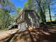Home exterior with a two car garage and stairs to the front porch at 65 Bridge Dr, Douglasville, GA 30134