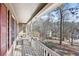 White wooden porch with red shutters and view of backyard and neighborhood at 65 Bridge Dr, Douglasville, GA 30134