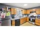 Functional kitchen features stainless steel appliances, granite countertops, and ample cabinet space at 65 Bridge Dr, Douglasville, GA 30134