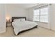 Spacious bedroom with a king-size bed and large window at 102 Chestnut Dr, Canton, GA 30114