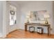 Light and airy entryway with hardwood floors, console table, and two lamps at 102 Chestnut Dr, Canton, GA 30114