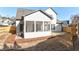 White house exterior with screened porch and fenced yard at 102 Chestnut Dr, Canton, GA 30114