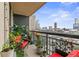 Outdoor balcony area with red patio furniture and city views at 3481 Ne Lakeside Dr # 1508, Atlanta, GA 30326